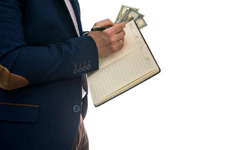 man holding open notebook signs purchase or lease agreement with cash isolated on white background.