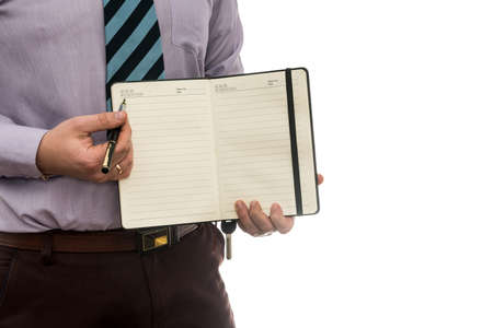 businessman signs purchase or lease agreement or filling notepad isolated white background