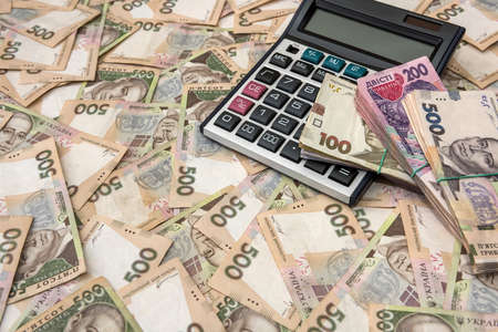 500 hryvnia bills with calculator as background. Close up. Top viewの写真素材