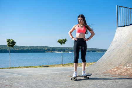 Teenager girl ride her skateboard. Healthy lifestyle