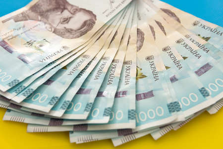 1000 new banknote of Ukraine on yellow blue background. Save and money cocncept. Ukrainian Money.の写真素材