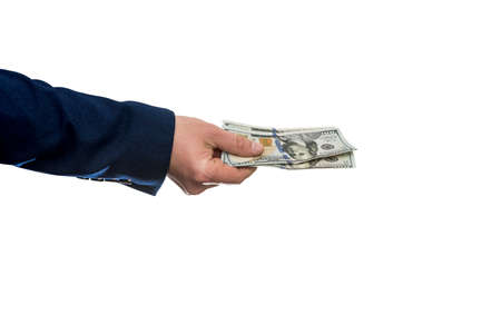 Man's hand in suit giving us dollar isolated on white background. Close up.