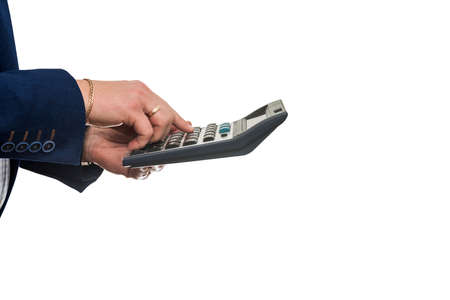 businessman hold calculator counting profits isolated on whiteの写真素材