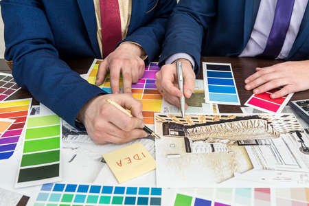 design team working at office under house project. Apartament scetch with color palette. Modern sweet home.の写真素材