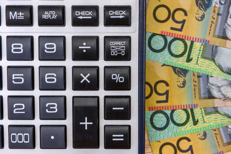 Australian money aud with calculator on desk.