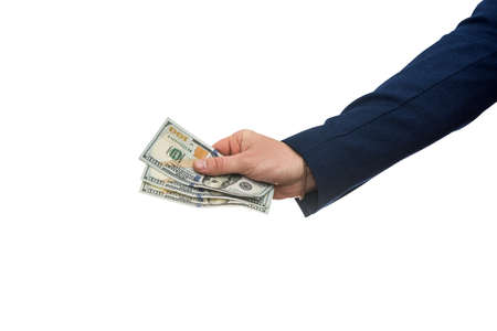 Man's hand in suit giving us dollar isolated on white background. Close up.の写真素材