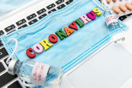 Medical disposable face mask with text covid-19. Coronavirus who causes pneumonia. Worldwide...