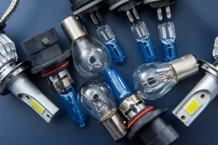 different headlight lamp on dark background. Modern diode halogen and other lamp