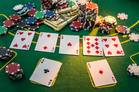 Poker chips and dollar bills in casino table. Doing bet in game and win! Gamble