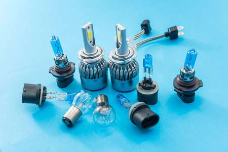 Halogen diode car bulb isolated on color background for repair. modent equipment for headlight. lamp...