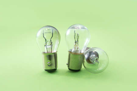 Electric light bulb isolated on color background. Eauipment for car headlight, technology
