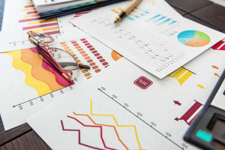 financial charts, work at paper business diagram with pen, at office. Graph market accountingの写真素材