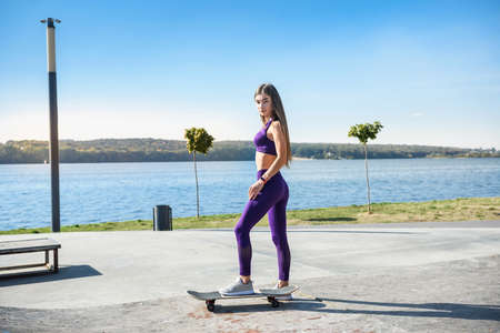 Teenager girl ride her skateboard. Healthy lifestyle