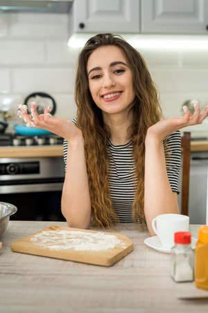 Woman cooking bakery eat, mixing ingredients: flour, eggs, oil and other.