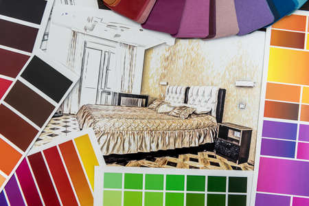 architect drawing of modern apartament blueprints with color paper material sample on creative desk....
