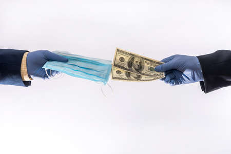 sale of a medical mask for dollars during the viral infection of the pandemic, the price is very high. health conceptの写真素材