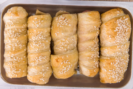 tasty roll sausages baked in dough. fresh delicious homemade snackの写真素材