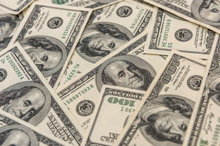 100 one hundred us dollar banknotes as seamless texture and background for design. wealth saving conceptの写真素材