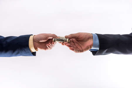 Business people transfer us money isolated on gray background. finance conceptの写真素材