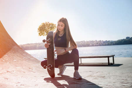 Teenager girl ride her skateboard. Healthy lifestyle
