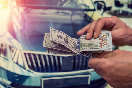 purchase new acr concept. man holding dollar for rent auto. financeの写真素材