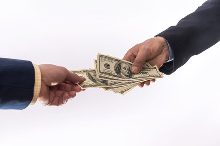 hands giving 100 dollar bills isolated. transfer money