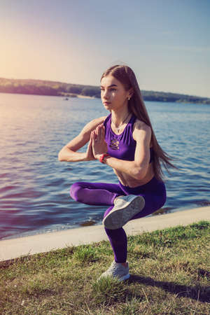 beautiful girl doing a yoga pose early morning before working time. Healhty lifestyleの写真素材