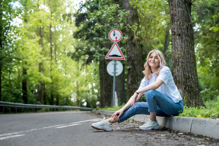 happy woman in forest enjoy free summer time over woods backgroundの写真素材