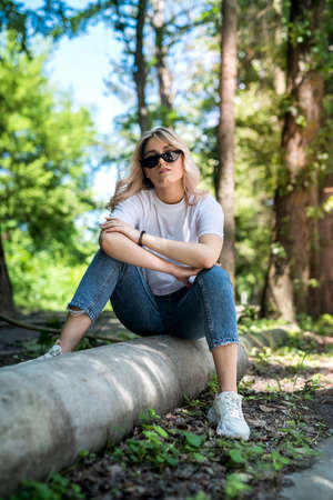 young lady walks in the woods and have a great time outdoors. summer