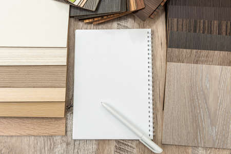Empty notepad with wooden floor catalog for new design your home. Plank laminate collection for decoration interiorの写真素材