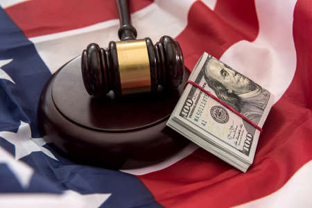american flag and dollar cash money as background of economy of USA. finance