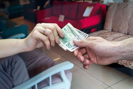 client giving dollar real estate agent for rent or sale new apartment. dream