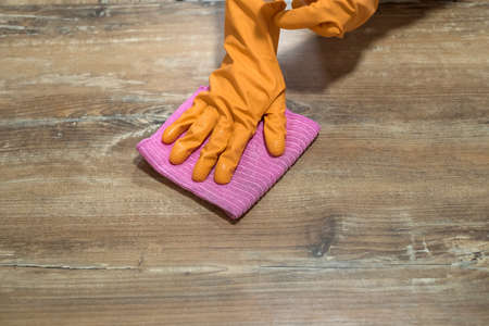 woman holding a rag in the kitchen and ready to clean. concept of cleanlinessの写真素材