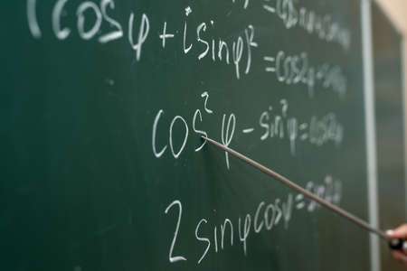 Schooling. Mathematical formulas are written on the blackboardの写真素材