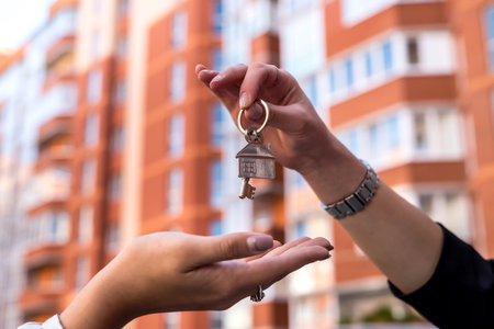 Handing the home keys between realtor and new owner. sale conceptの写真素材