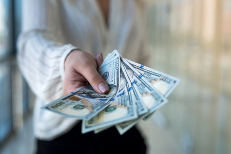 woman count us dollar in mall. business or purchase concept. finance ideasの写真素材