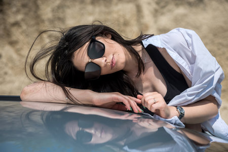 Portrait of pretty woman inside car. summer time for journeyの写真素材