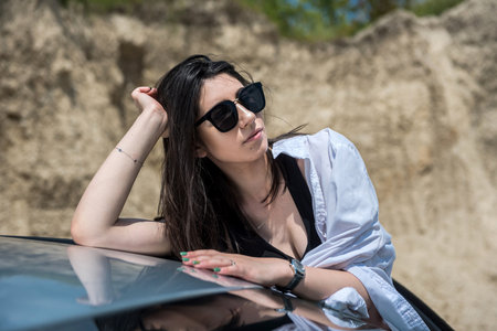 Portrait of pretty woman inside car. summer time for journeyの写真素材