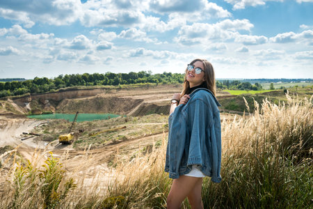 Portrait beautiful caucasian woman in the green field in summer time. lifestyle