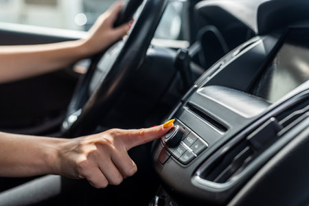 female hand close up in car, woman inside in autoの写真素材