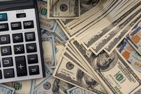 Calculator and 100 dollar bills, saving conceptの写真素材