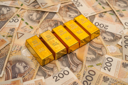 Stack of gold bars of zloty bills. pln wealth