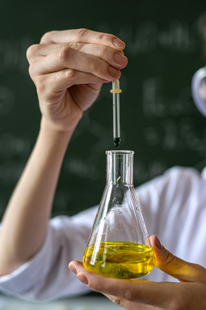 chemistry teacher examines conical flask with color liquid, explane lesson