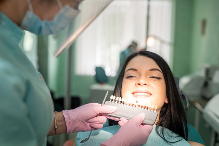 Young woman in dentistry with doctor talking about teeth hygiene