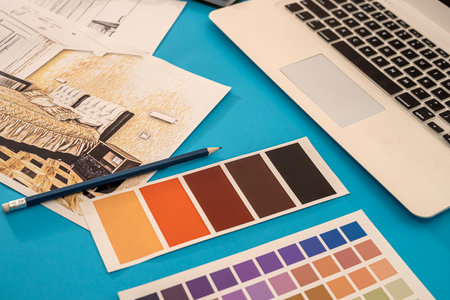 on the background are laid out drawings of the house with a compass, pencil, and colored palette. design conceptの写真素材