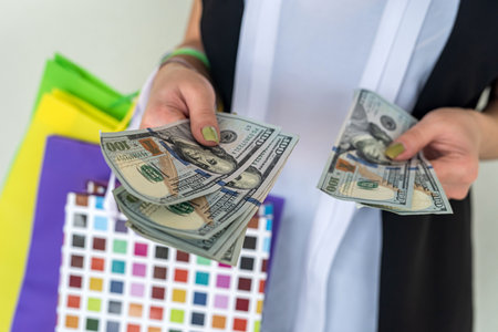 woman cound dollar after shoping crazy black friday. discount conceptの写真素材