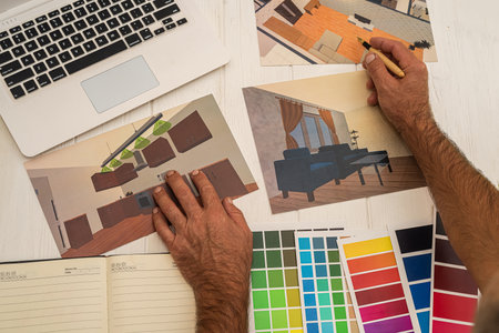 designer working with color palette and house plan sketch. design studio