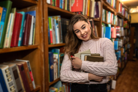beautiful young girl after school studies in the city library. library concept