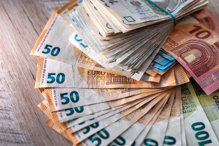 Stack of polished zloty and euro money as finance background. business and financial conceptの写真素材