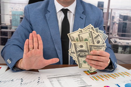 the director of a profitable firm reviews the firm's profit and expense charts. Big and small business conceptの写真素材